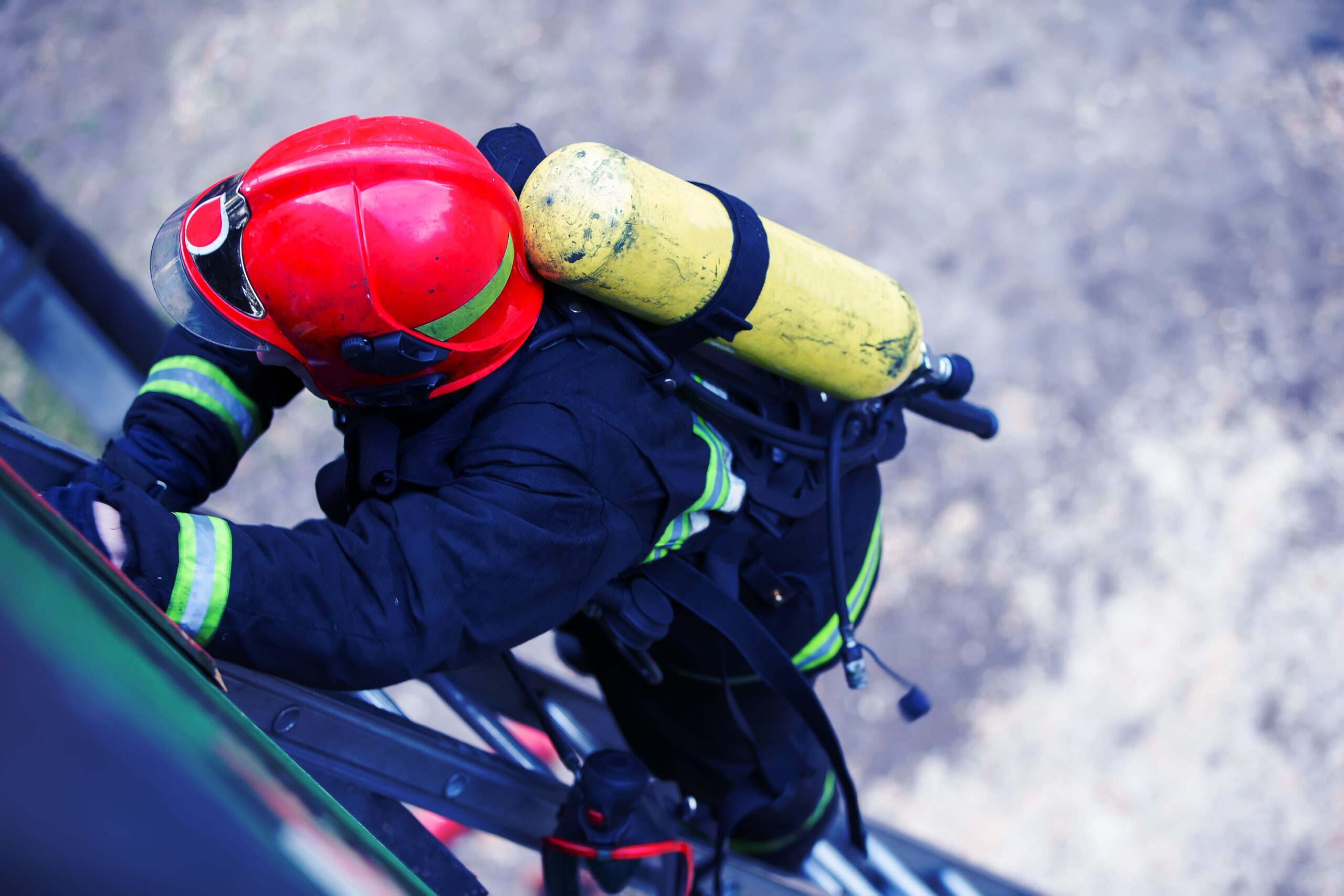 Firefighter climbs the stairs. Lifeguard training.